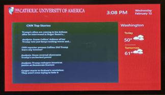 Image of digital display monitor with university-related content.